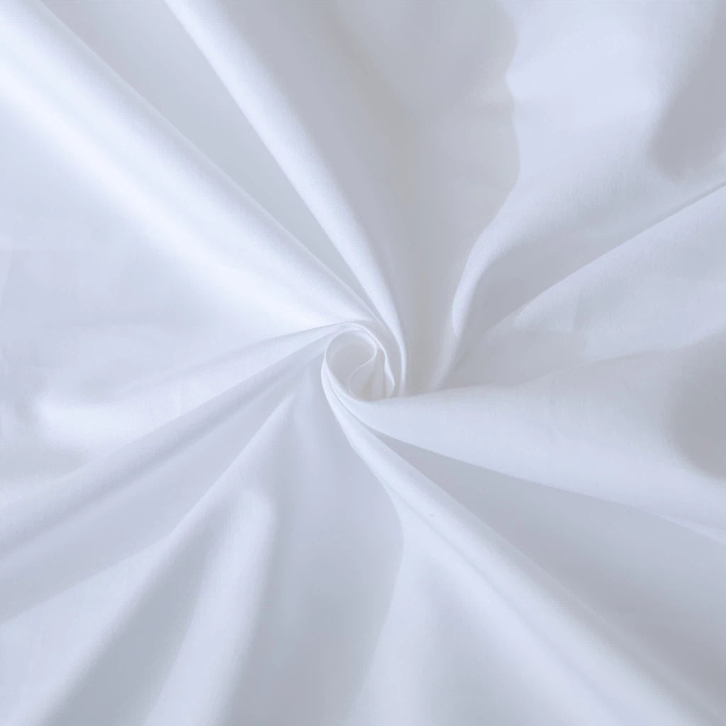 Elegant white fabric spiraling into a soft vortex, depicting a sense of smoothness and purity.