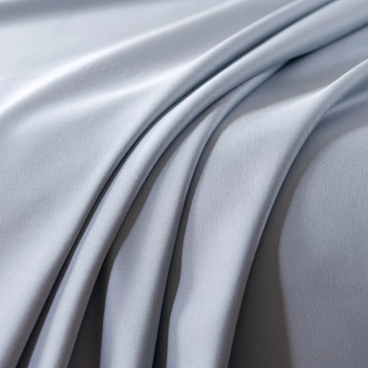 Graceful folds of smooth Linenly satin weave fabric in a cool, silvery tone.