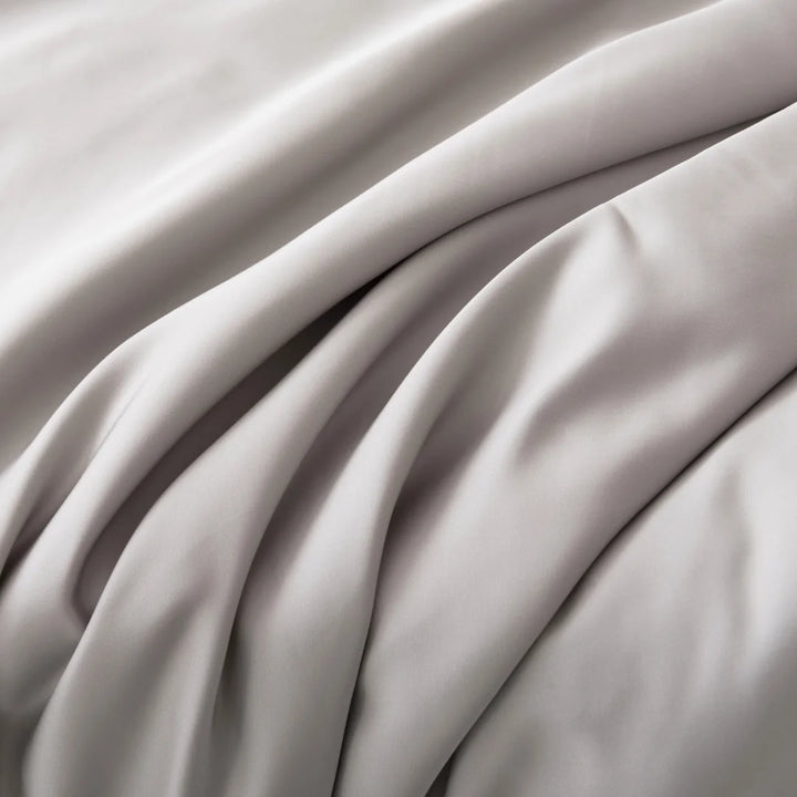 Elegant Linenly silver satin weave fabric with graceful folds and a luxurious smooth texture.