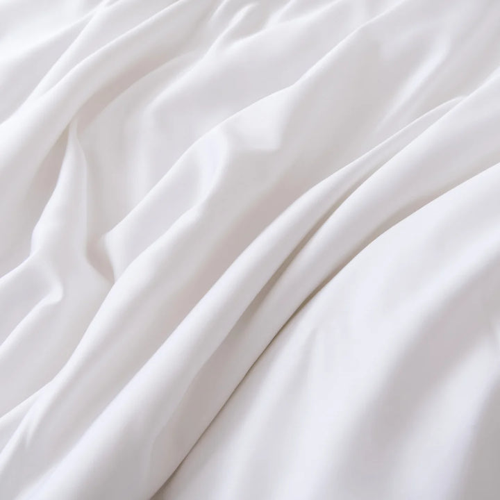 Pristine white satin weave fabric with soft folds creating a tranquil and smooth texture Linenly Bamboo Pillowcase Set - White.