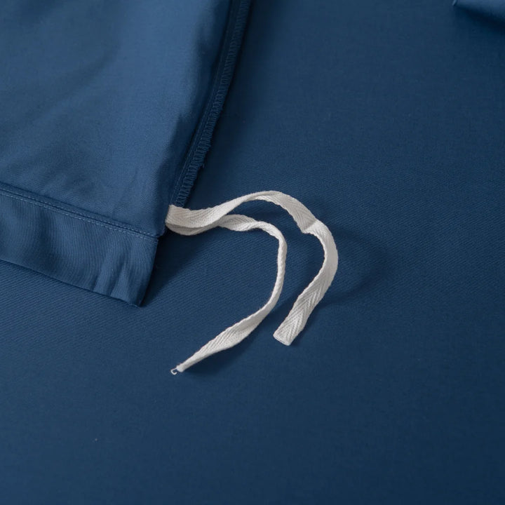 Close-up of Linenly's Bamboo Quilt Cover - Midnight, showcasing its silky texture and precise stitching, with a white drawstring on top revealing its supreme softness.