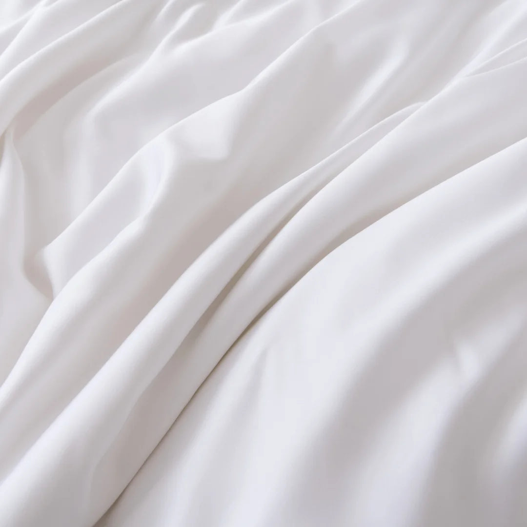 Soft white Linenly bamboo sheet set with gentle folds creating an ultra-soft and smooth texture.
